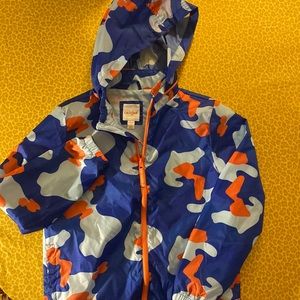 Blue and orange patterned windbreaker jacket.